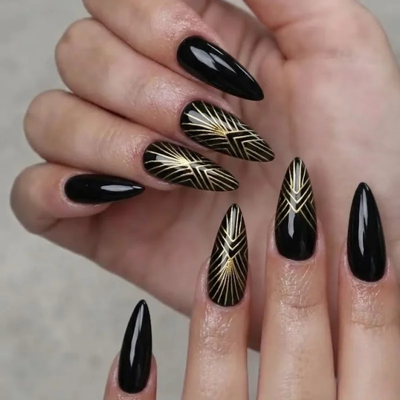 Art deco black and gold geometric nail design for a dressy winter holiday event