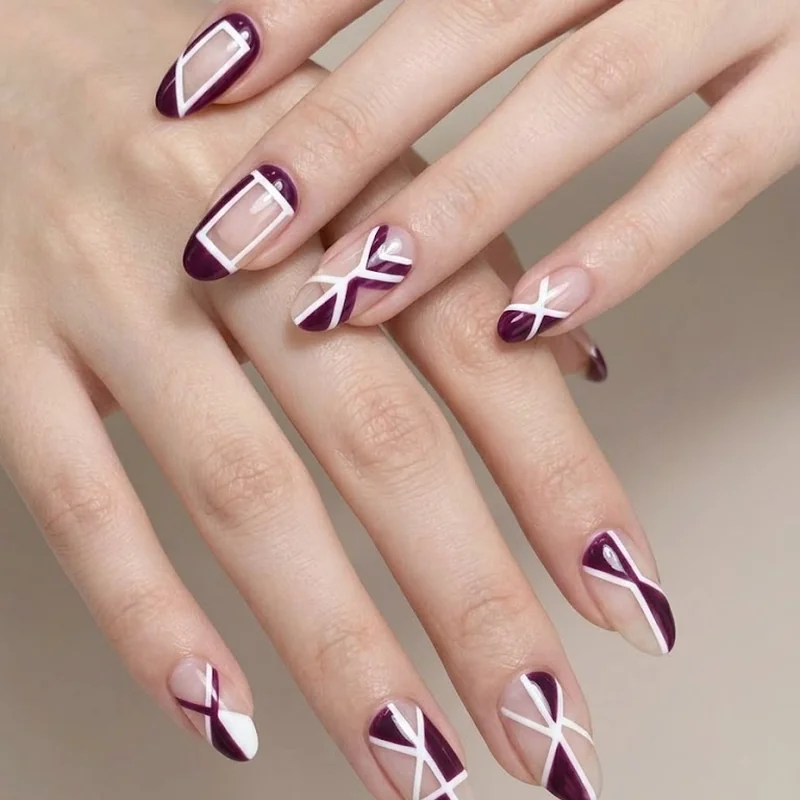 Bold negative space geometric nail art design for a statement winter manicure