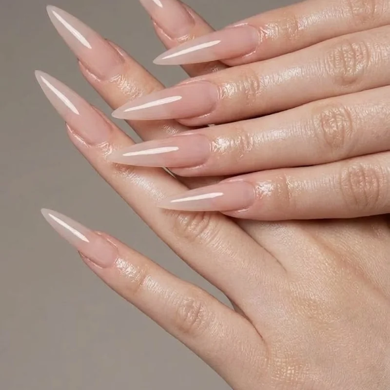 Clean glossy top coat finish nail close up conveying healthy well maintained winter nails