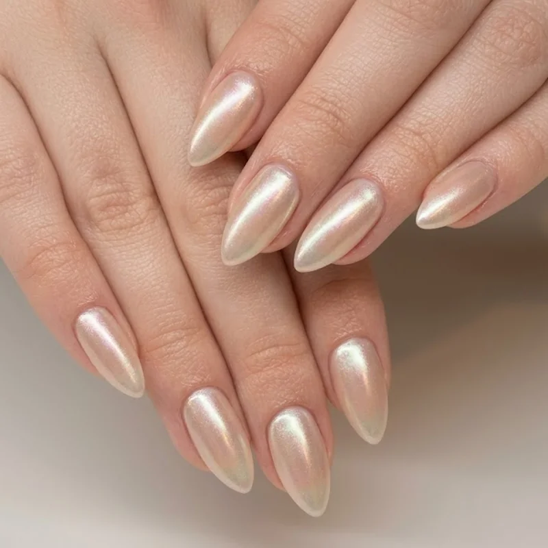 Frosted pearlescent chrome over nude base, a wearable metallic winter manicure