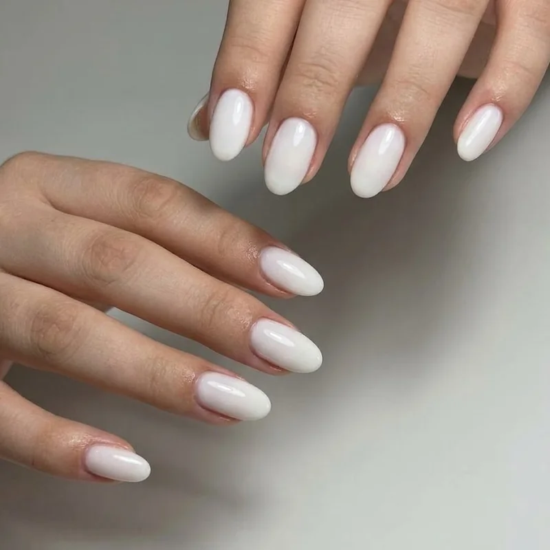 Gel polish milky white finish on short oval nails for winter