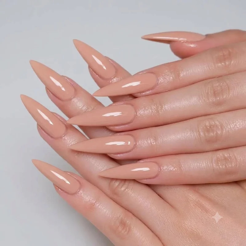 Glossy nude manicure with high shine top coat finish for an effortless winter nail look