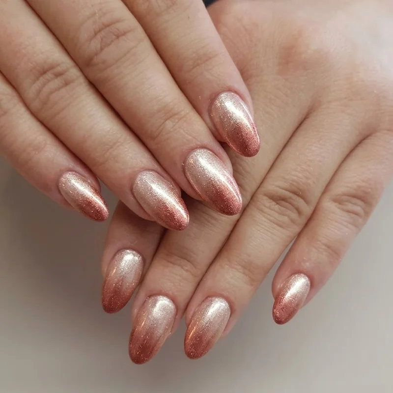 Rose gold shimmer gradient nail manicure for a warm winter metallic finish