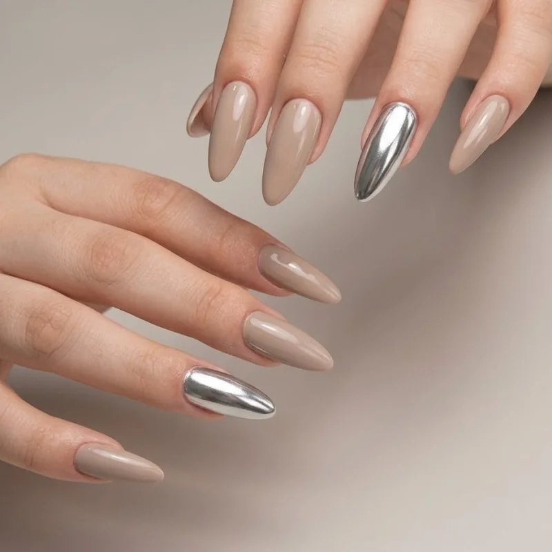Silver chrome accent ring finger nail over a neutral winter manicure base for an easy trend test
