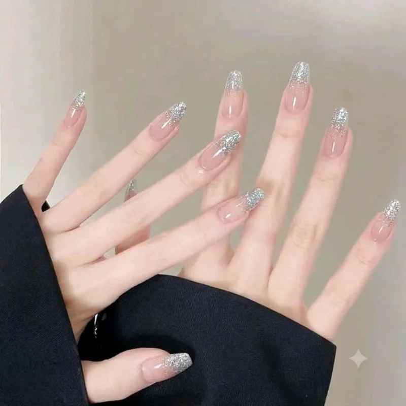 Silver glitter ombre French tip manicure for winter holiday season