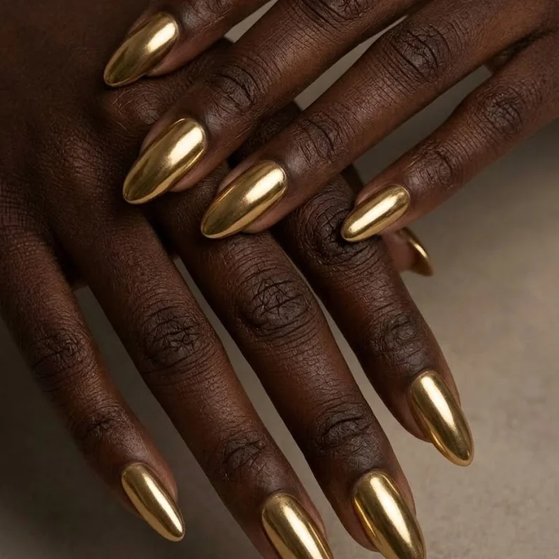 Chrome metallic finish winter nails for dark skin showing reflective quality in low light