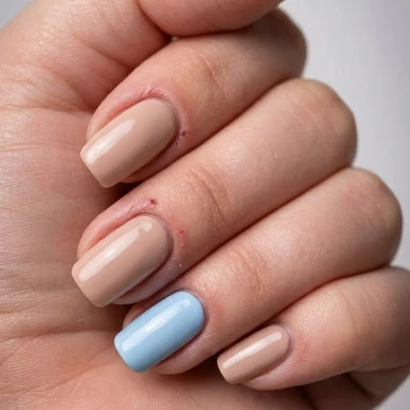 Something blue winter wedding nails soft baby blue accent on neutral bridal set