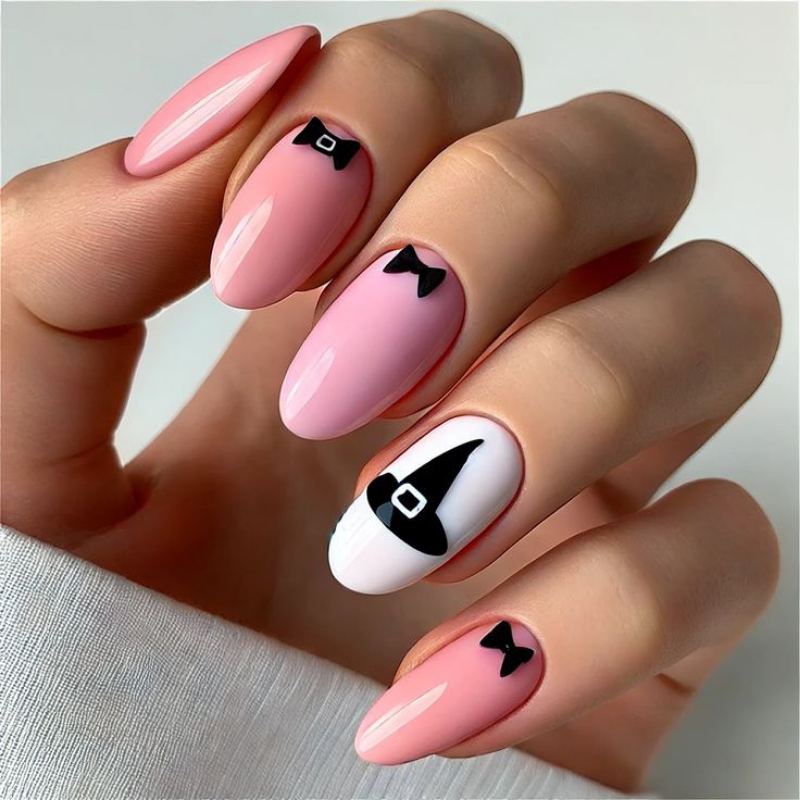 Deep purple witch hat design with gold buckle detail on dark Halloween manicure