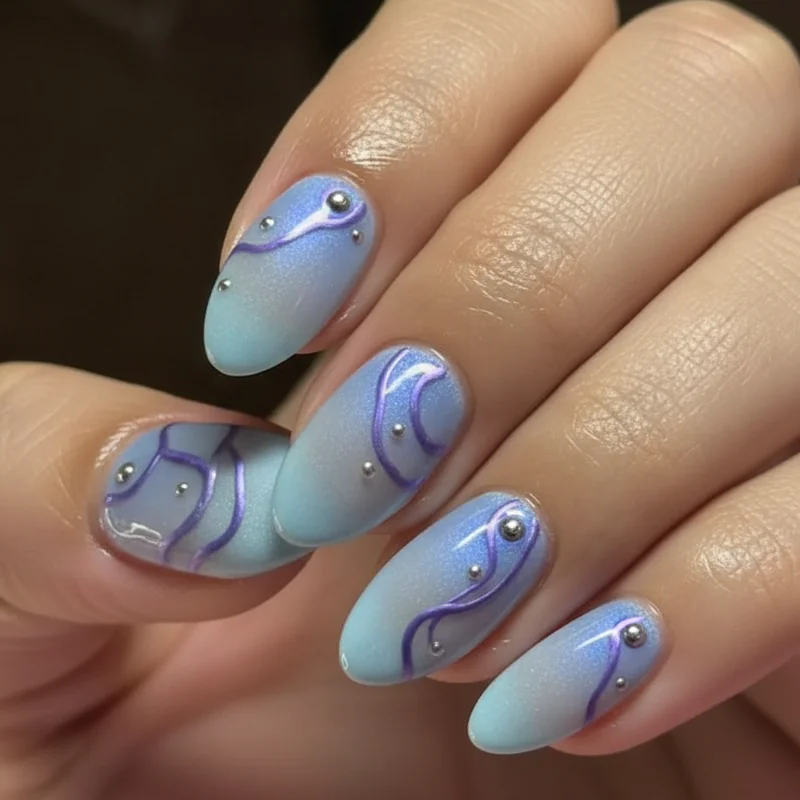 Aquarius nail spectrum from subtle icy blue chrome single finish to maximalist amethyst aura with rhinestone accents showing full design range
