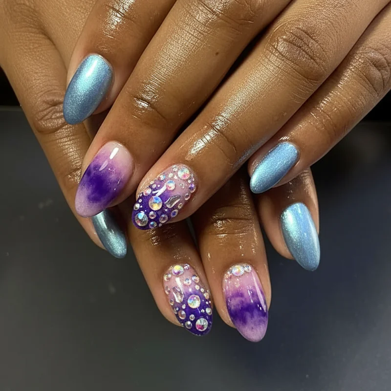 Chrome aura and velvet cat-eye nail finish comparison for Aquarius designs showing 2026 trend options in icy blue and amethyst tones