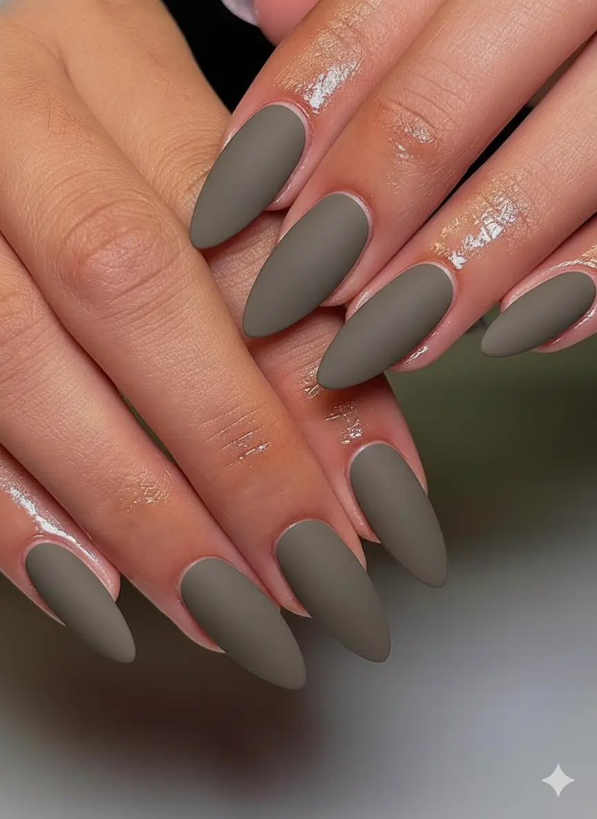 Capricorn nail art showing earth sign deliberate aesthetic with dark greige matte finish and precise cuticle care preparation close-up