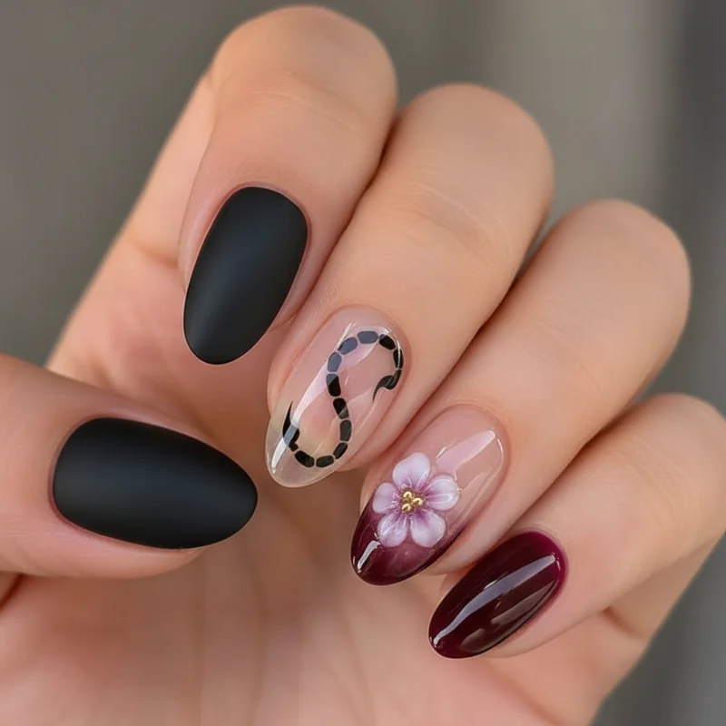 Scorpio nails for short nails featuring matte black squoval shape dark jelly burgundy and negative space designs for natural nail length