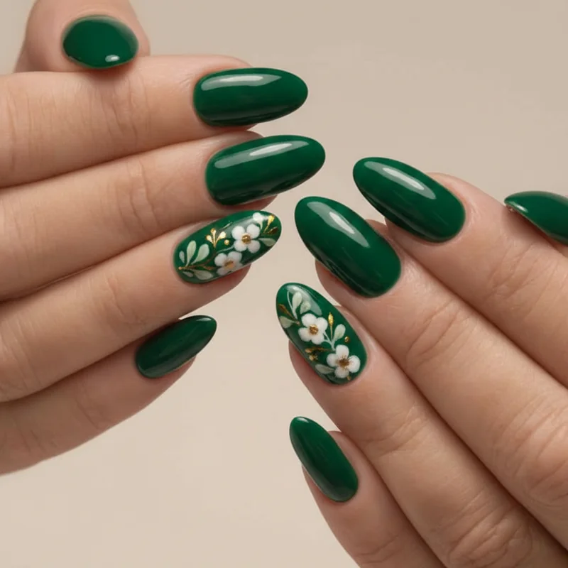 Taurus nails on short length featuring glazed emerald squoval shape with micro floral accent detail showing full aesthetic on short nails