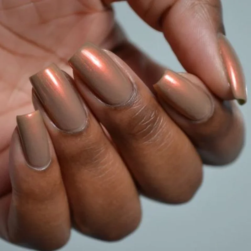 Deep warm undertone skin showcasing chocolate copper gold rich nail color palette luxurious depth