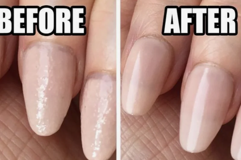 Using cotton swab dipped in nail polish remover to smooth and blend smudged nail polish area before reapplying coat