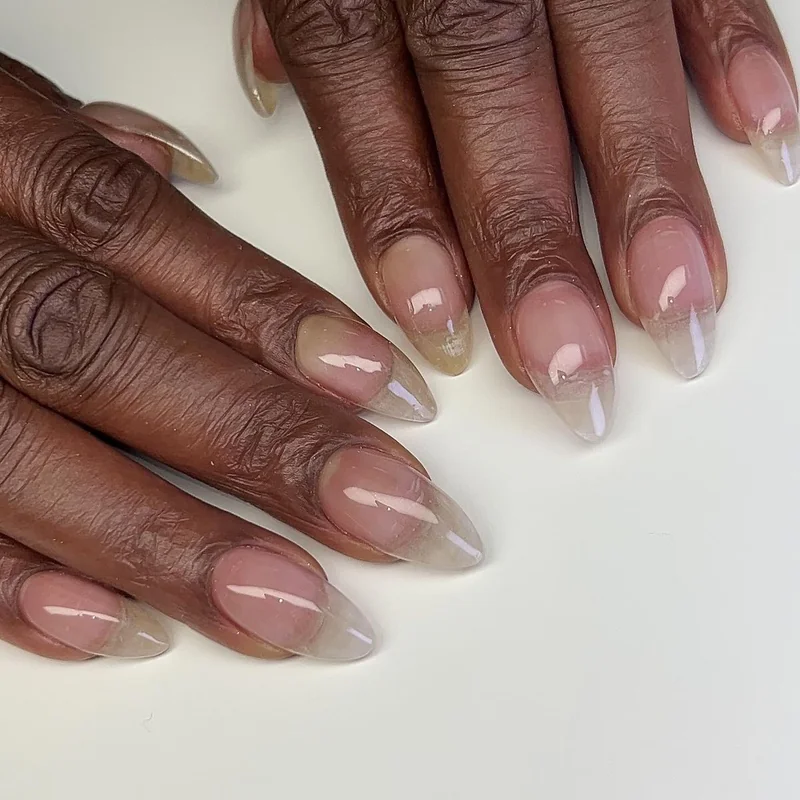 Glass nails showing glossy translucent finish using sheer polish technique achieving mirror shine result