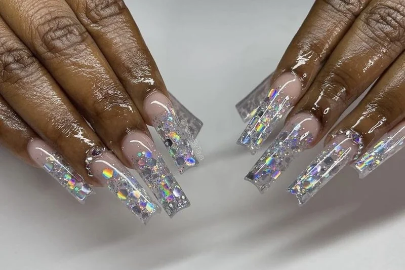 Glass nails effect showing ultra glossy translucent finish achieved with sheer polish and mirror shine top coat look