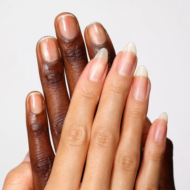 Hand cream being worked into nails and cuticles for deep moisturizing hydration treatment