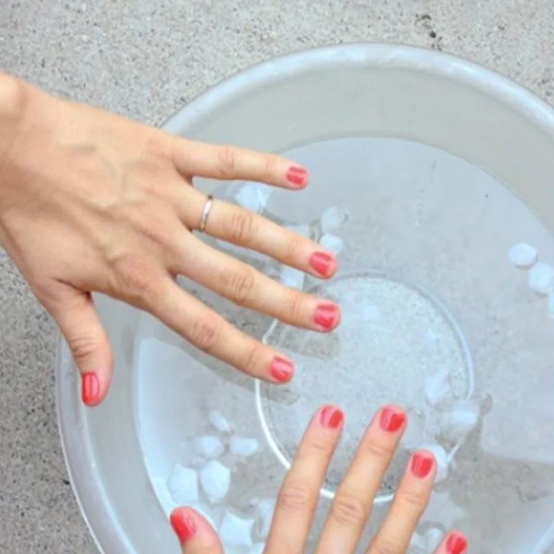 Ice water nail drying hack showing fast manicure hardening technique for quick polish setting