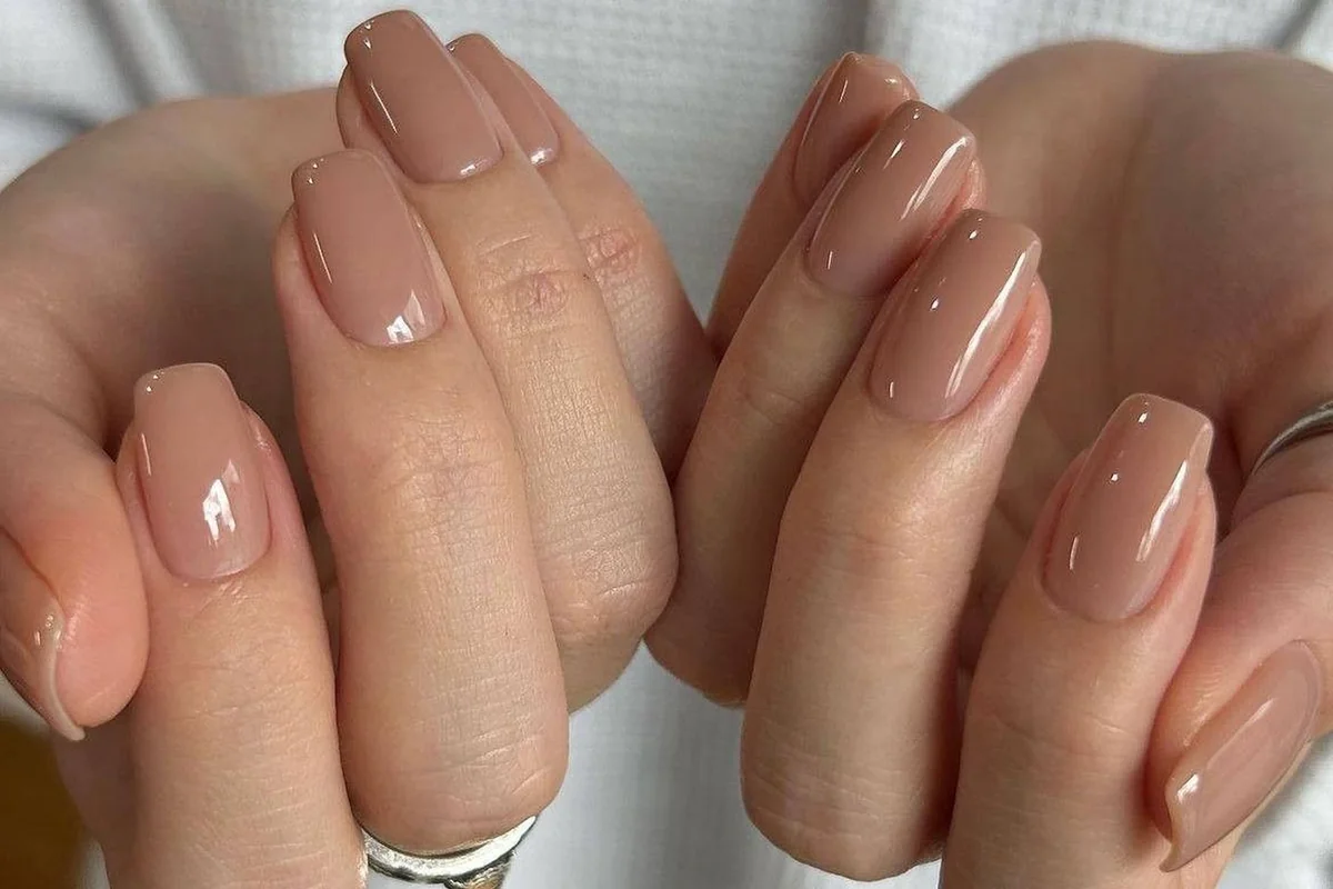 Professional neutral nail colors including nude beige soft pink and taupe shades for office work and corporate environments