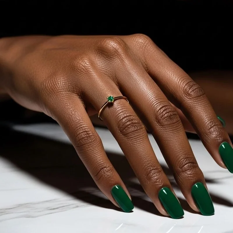 Olive skin tone wearing emerald jade burgundy rich jewel tone nail polish colors perfect harmony
