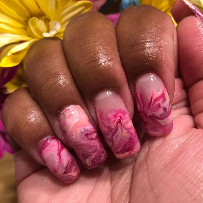 Plastic wrap creating marble texture nail effect showing easy stone pattern technique for beginners