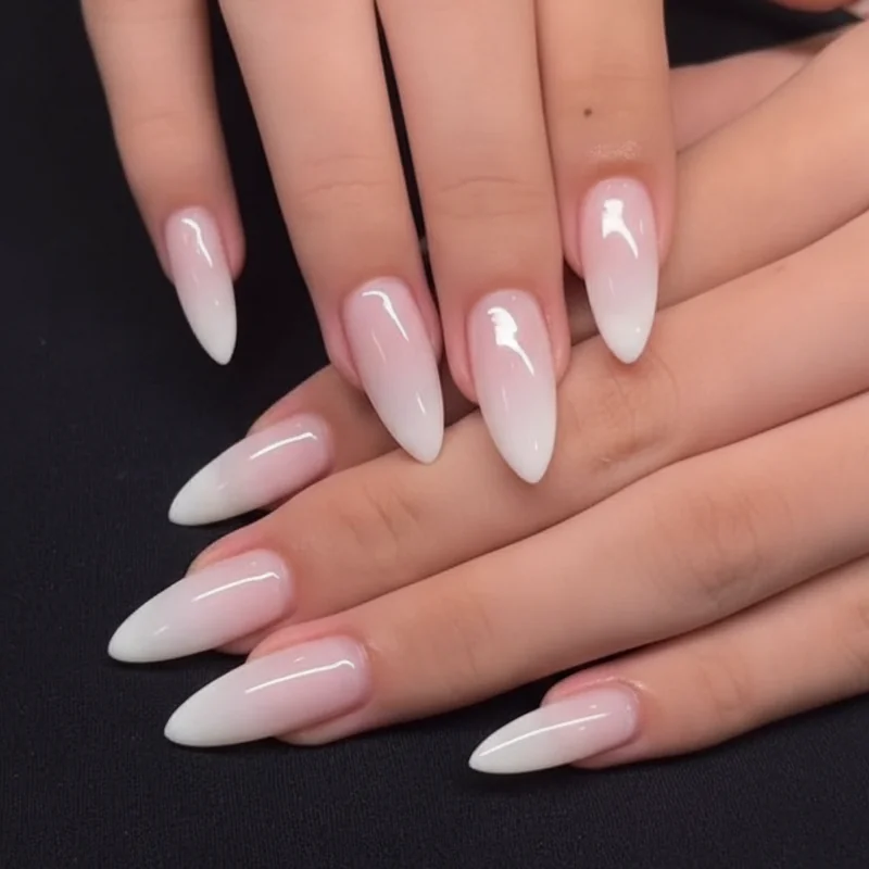 Mother of pearl glazed chrome nail trends 2026 on nude base pearlescent luminous finish short almond shape quiet luxury refined aesthetic