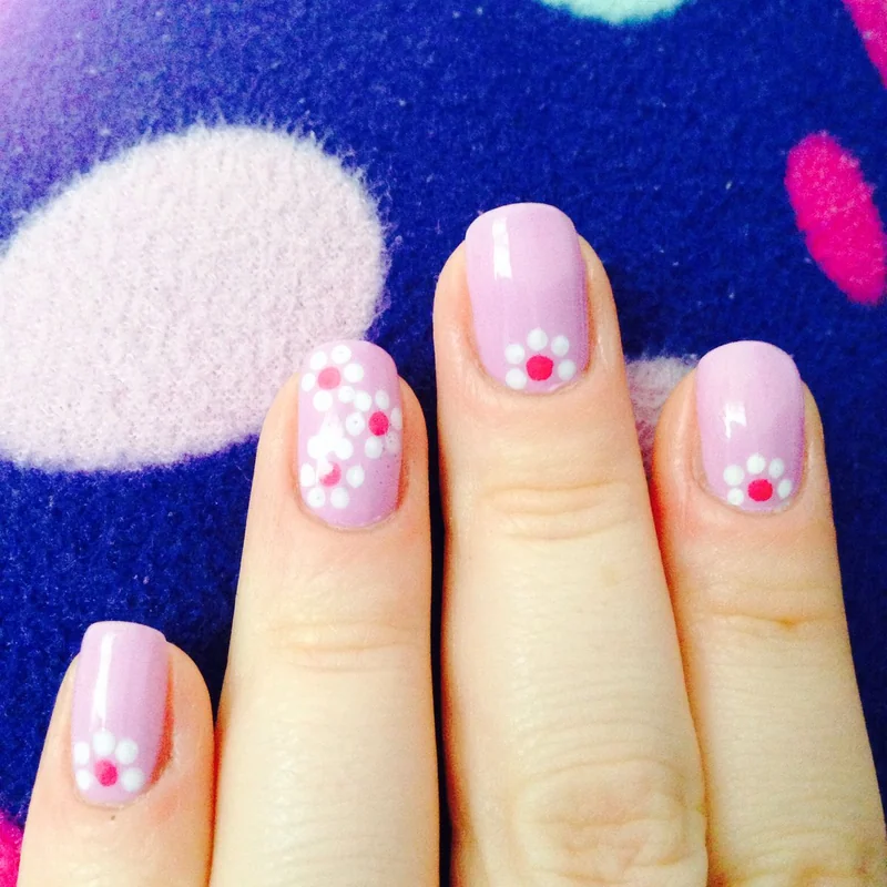 Toothpick creating dots flowers and marble nail art designs showing versatile household tool technique