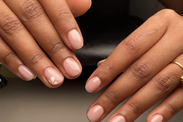Wellness nail aesthetic 2025 featuring short well groomed natural nails prioritizing health over length in modern beauty trend