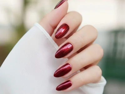 Winter 2025 burgundy velvet matte nails with micro shimmer finish almond shape sophisticated texture finish