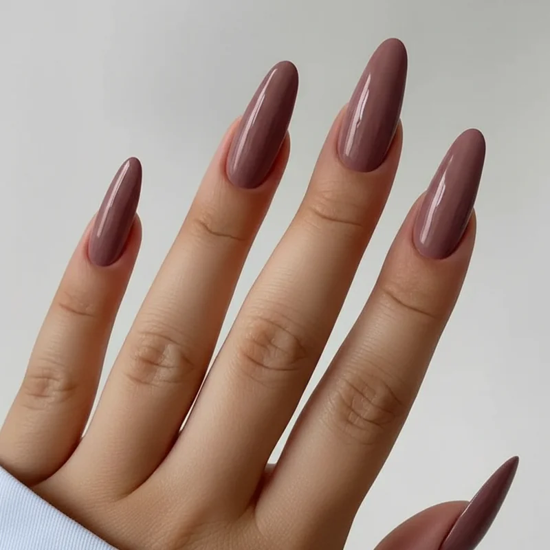 Corporate girl nail palette 2026 showing muted mauve mocha milky nude and soft navy colour swatches for professional women