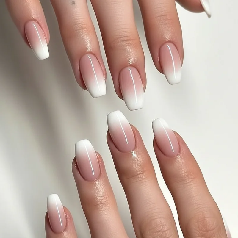 Micro-French and baby boomer corporate girl nails on squoval shape showing whisper smile line and soft ombre gradient comparison 2026