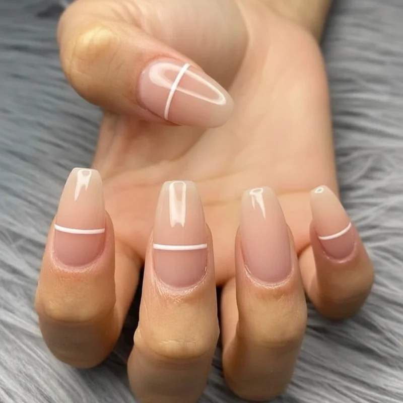 Striping brush fine line nail art application technique showing wrist rest position and single stroke method for clean professional DIY results at home