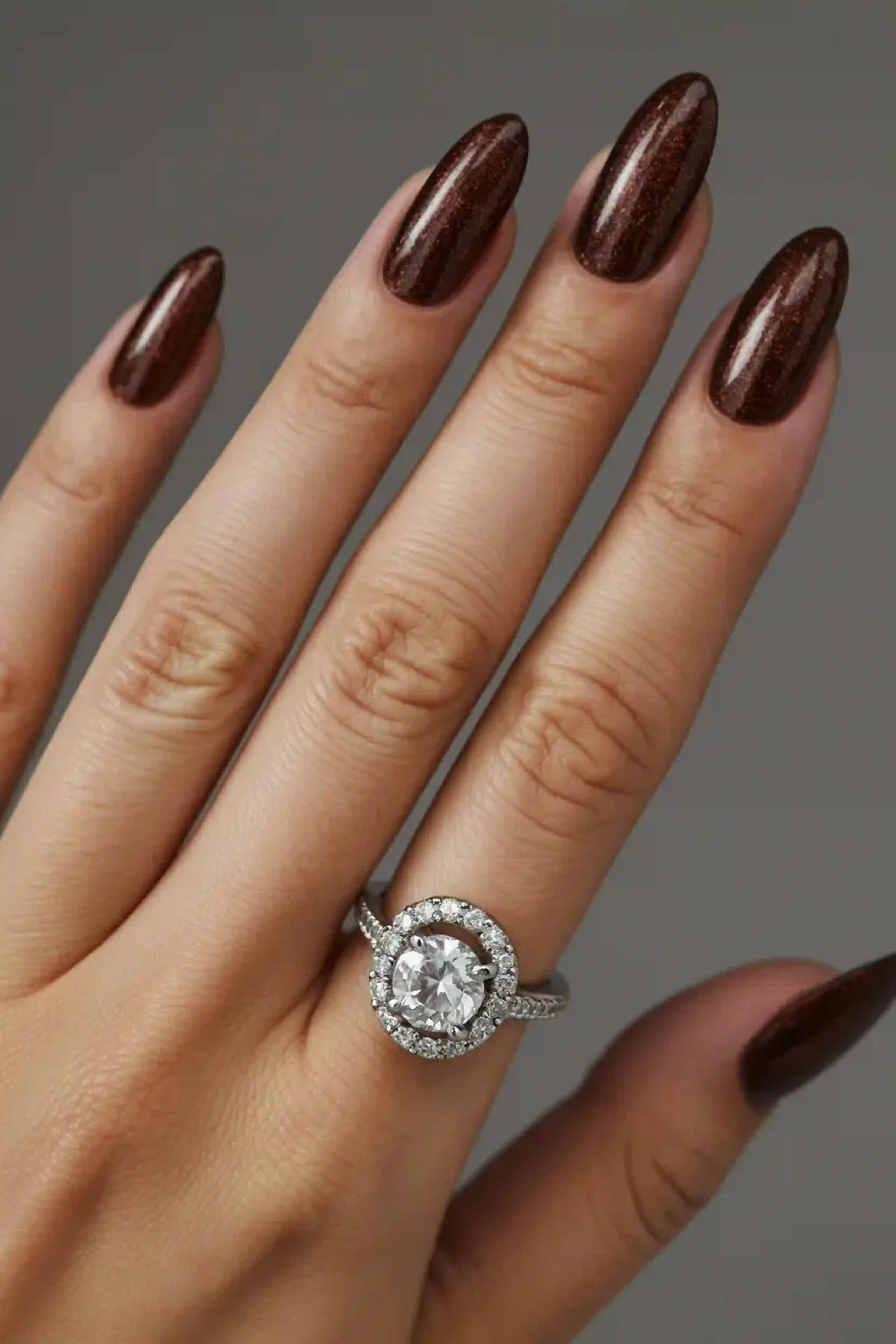 Chocolate brown almond nails warm autumn creating cozy seasonal trendy style manicure for fall vibes