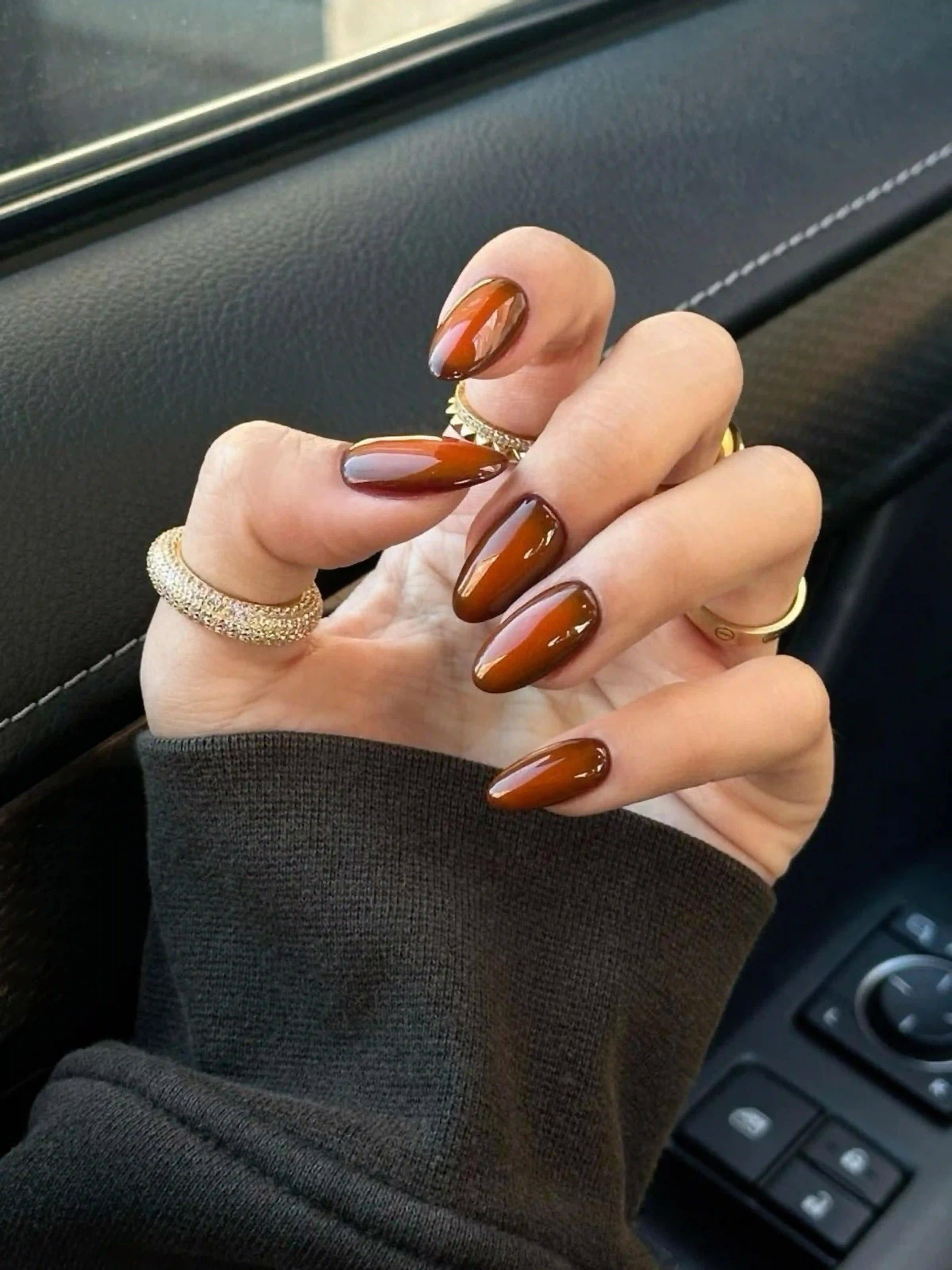 Copper almond metallic autumn warm nails with luxe shimmer creating trendy seasonal manicure for fall