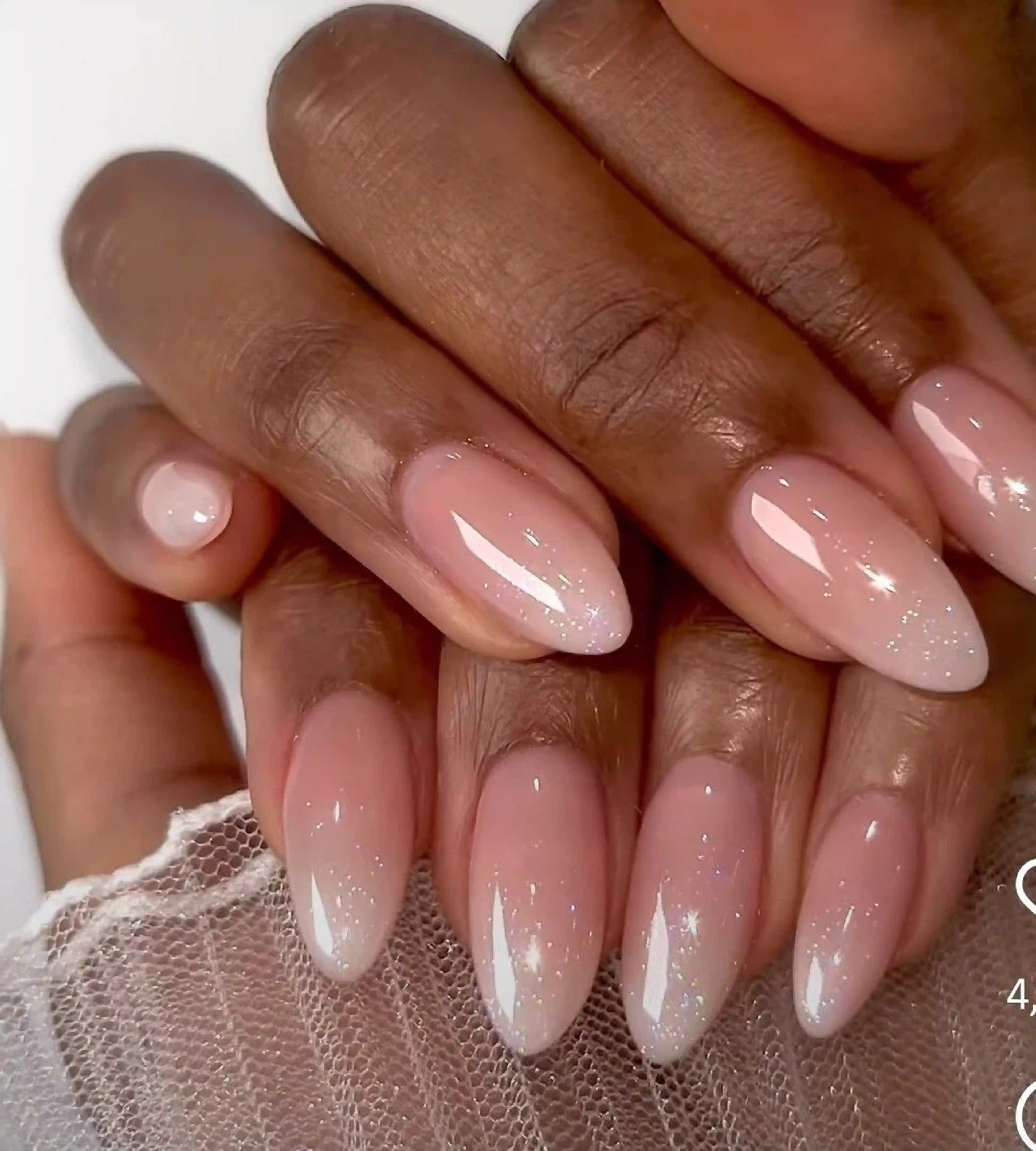 Ombre nude pink almond gradient nails with soft transition creating romantic elegant manicure for weddings