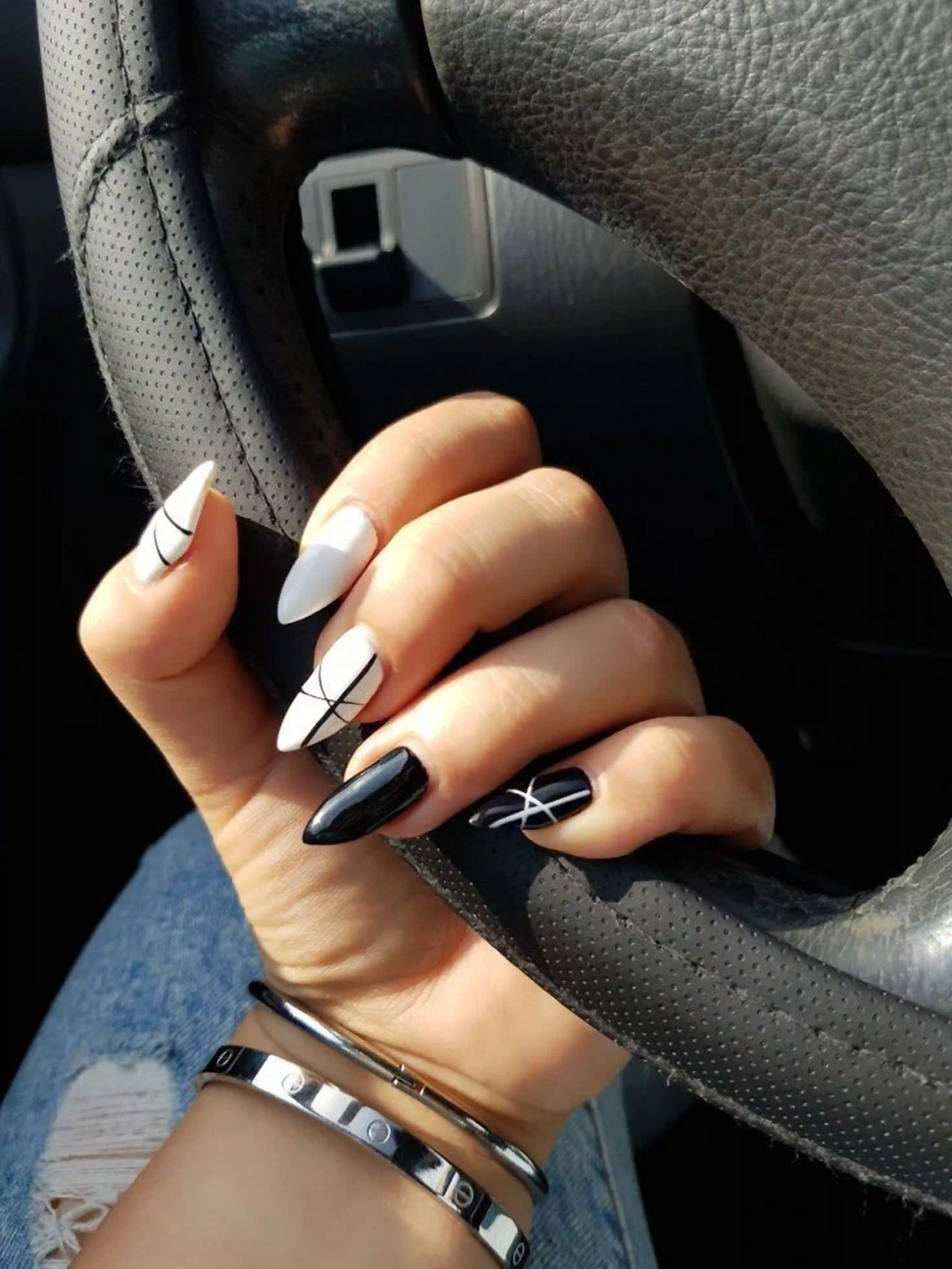 Striped almond black white nails geometric modern creating bold artistic design manicure for statement