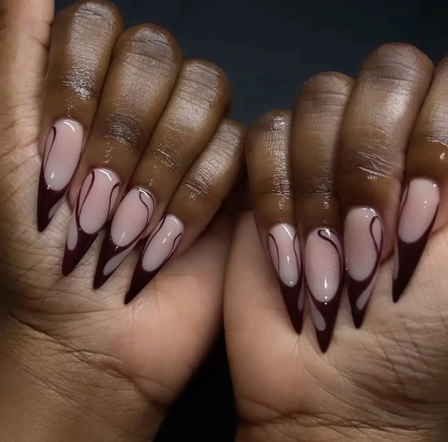 Burgundy black French ombre nails with gradient creating edgy modern winter manicure style perfect for bold fashion statement 2025