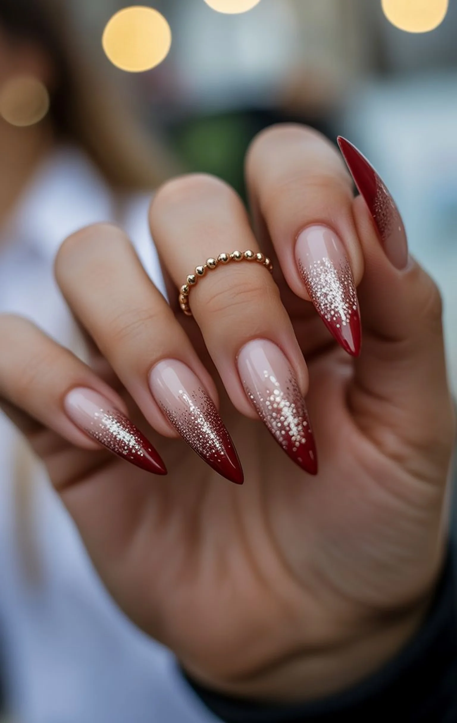 Burgundy silver glitter nails creating sparkly festive winter party manicure design perfect for holiday season New Year celebrations