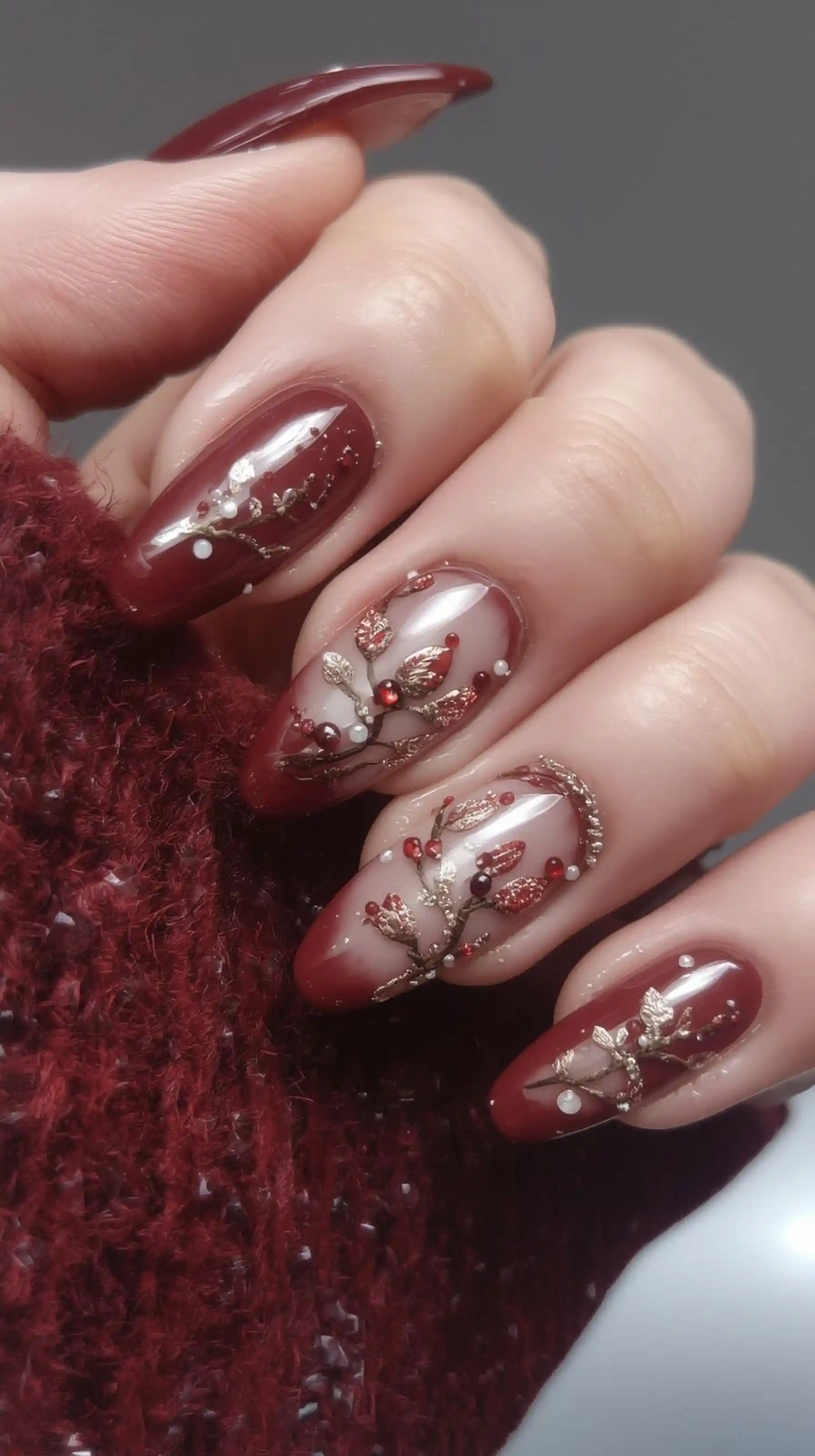 Deep wine burgundy nails with 3D flower art creating luxury winter wedding manicure design perfect for bridal romantic style 2025