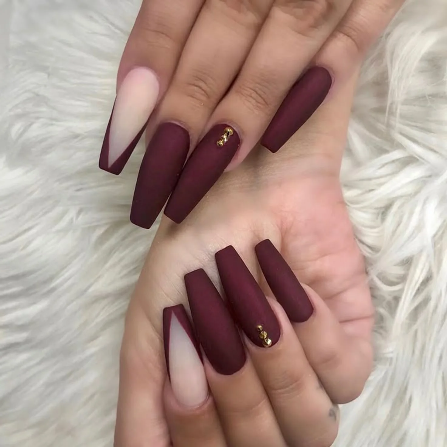 Mahogany burgundy long coffin nails with dark red finish creating dramatic statement winter manicure perfect for bold style 2025