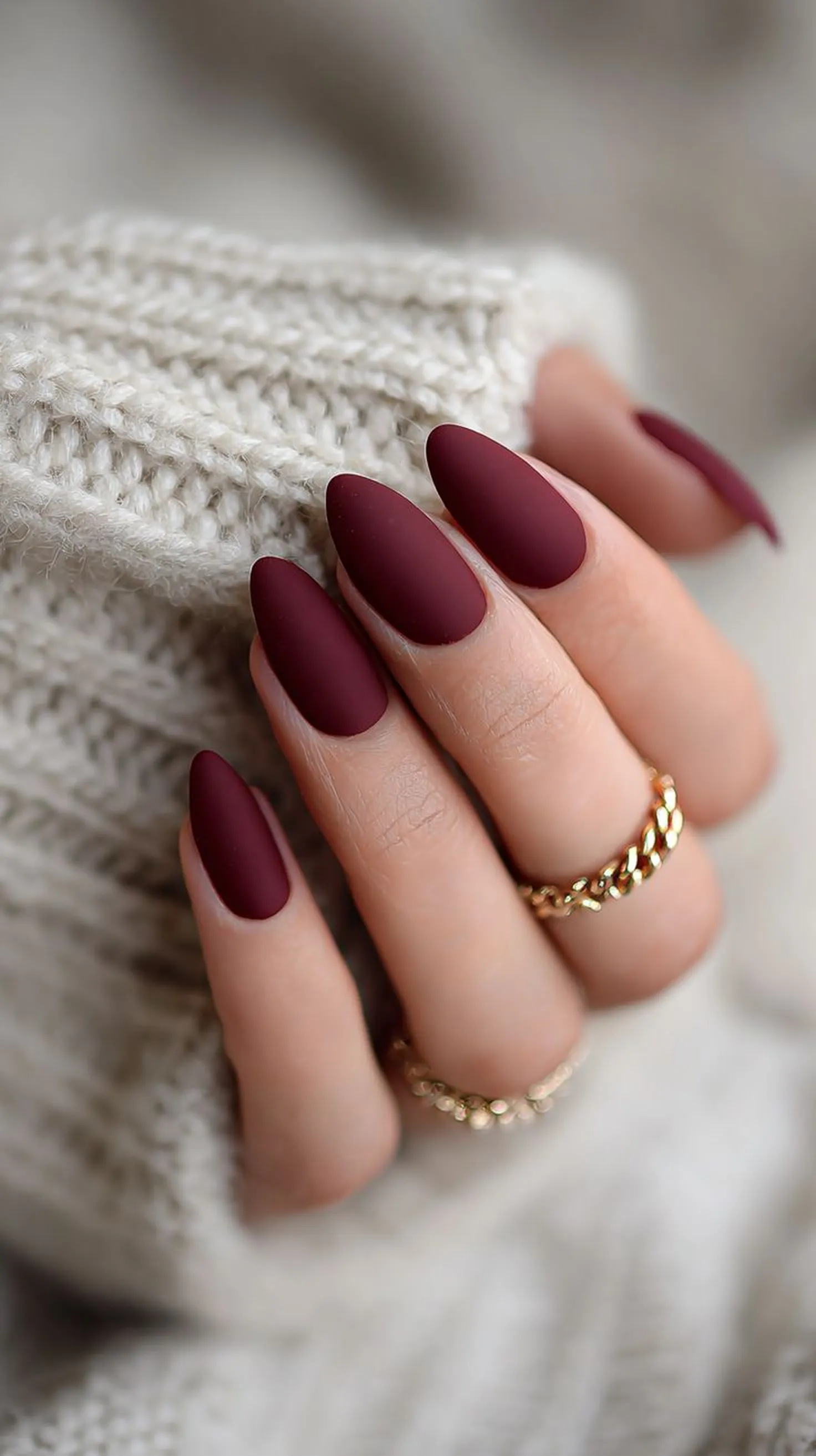 Oxblood burgundy matte nails with soft finish creating sophisticated winter manicure style perfect for elegant evening events 2025