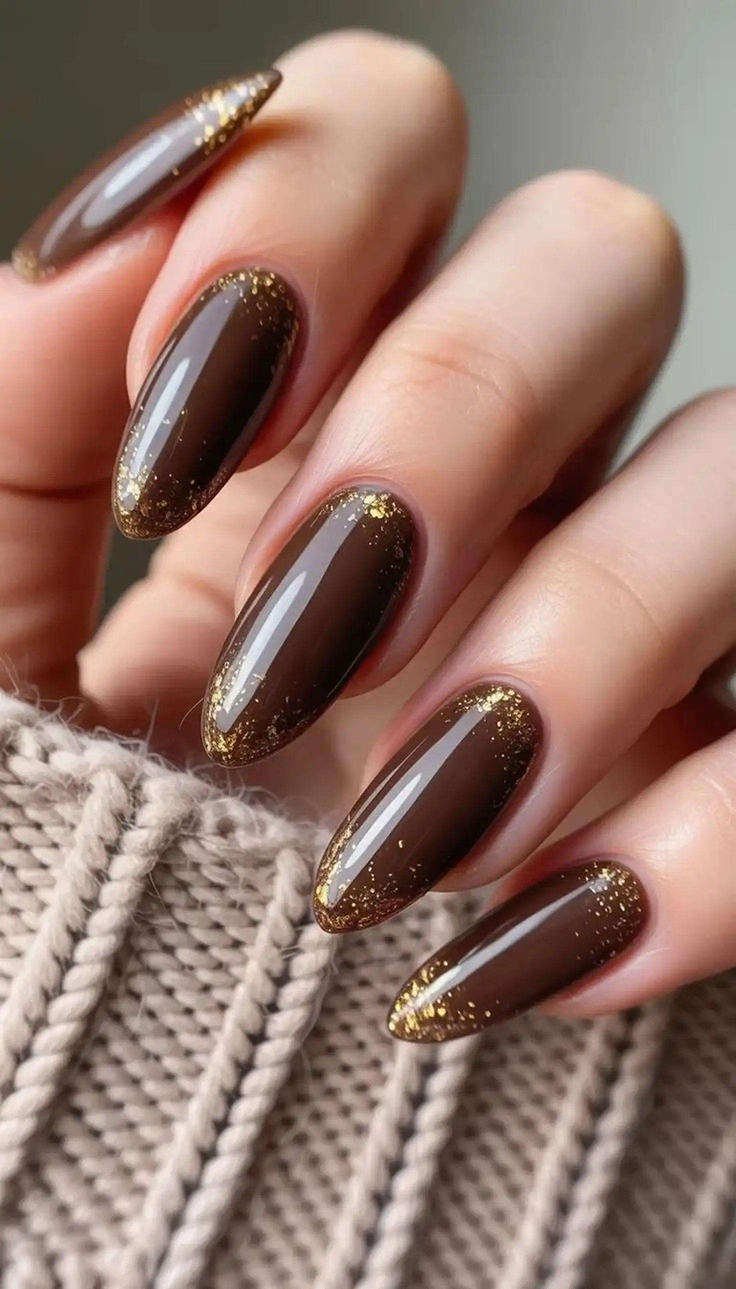Caramel brown gold glitter nails creating sparkly warm festive winter party manicure design perfect for holiday season celebrations