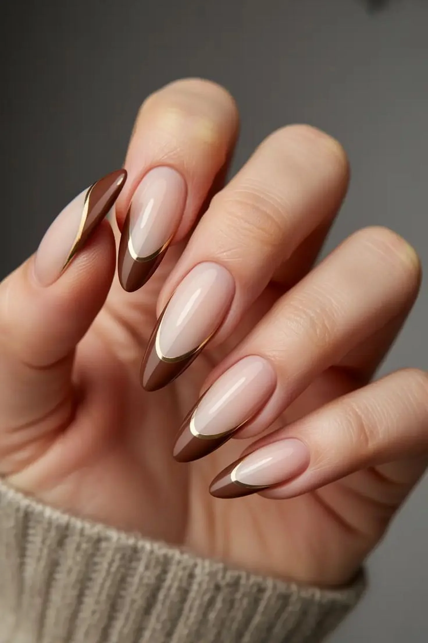 Chocolate brown French tips with nude base creating modern classic winter nail art perfect for sophisticated versatile manicure look