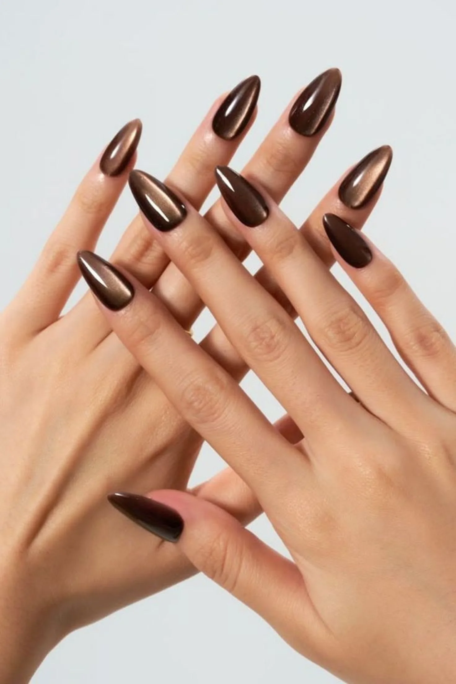 Mocha brown Pantone 2025 almond nails with warm elegant finish creating trending winter manicure perfect for cozy neutral style