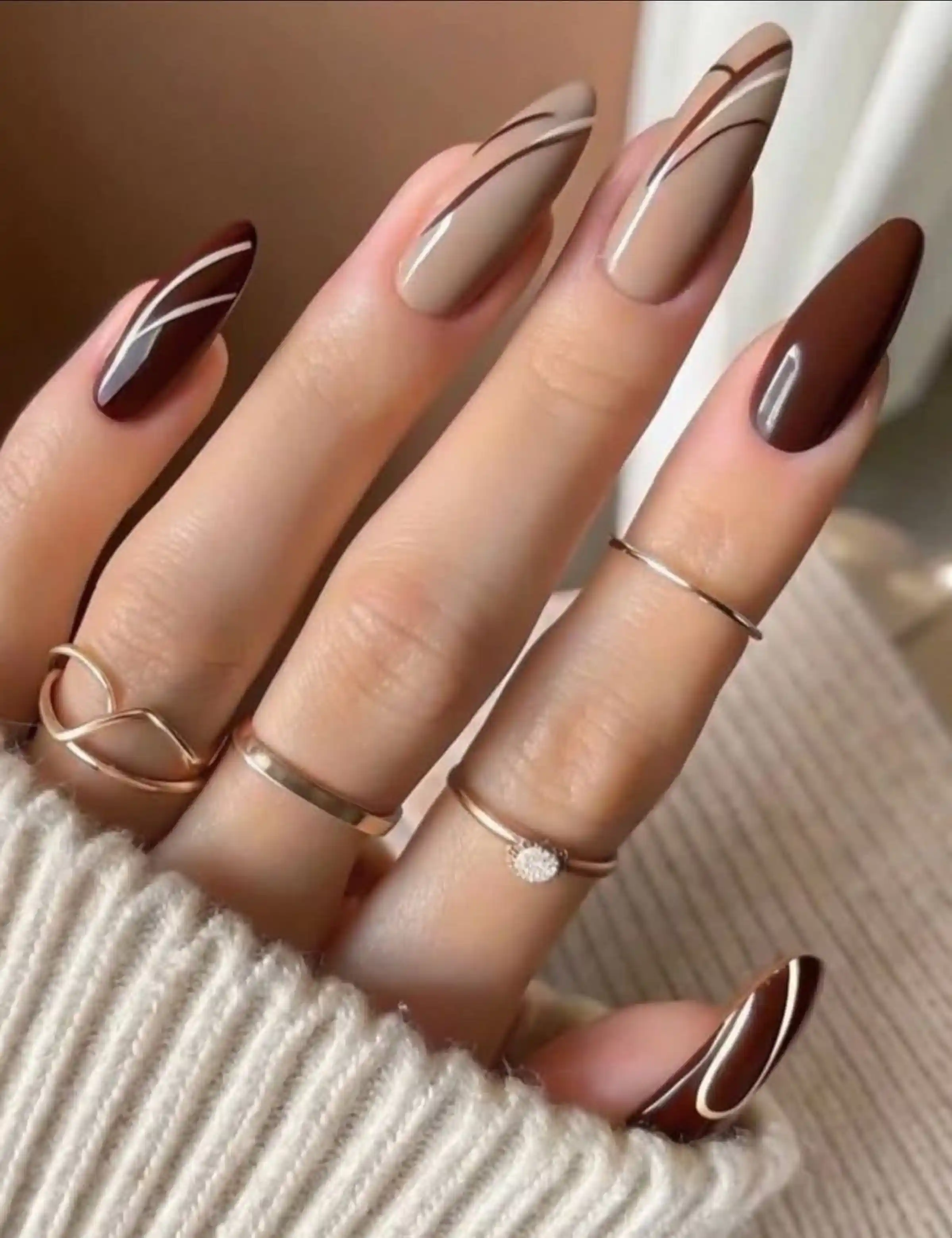 Mocha mousse glossy nails Pantone color of year 2025 creating trending winter manicure style perfect for fashion forward look