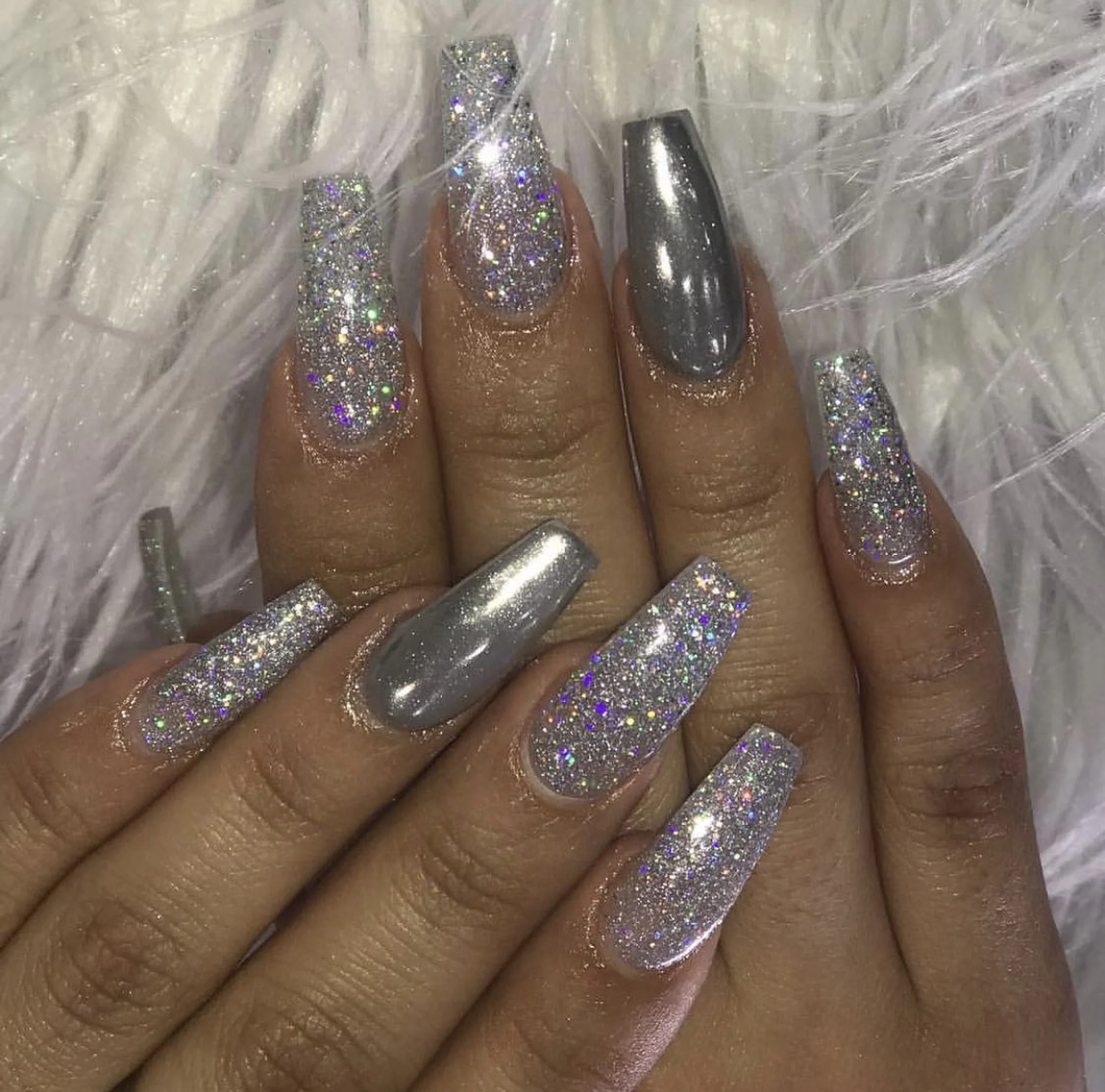 Icy silver chrome mirror finish coffin nails with ultra reflective metallic surface perfect for winter 2025 holiday parties