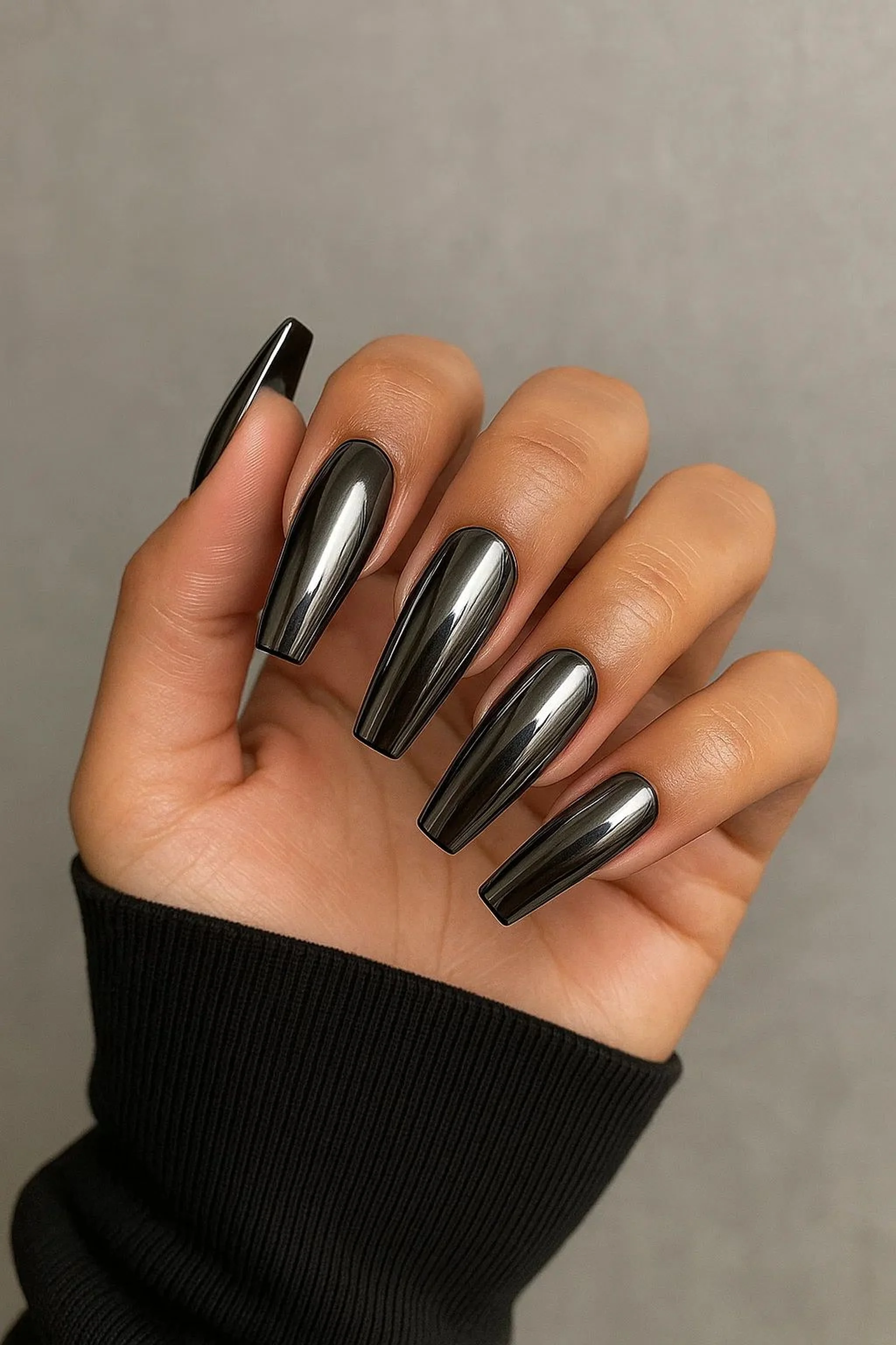 Titanium chrome coffin nails with dark metallic finish creating edgy statement winter manicure perfect for modern bold style 2025
