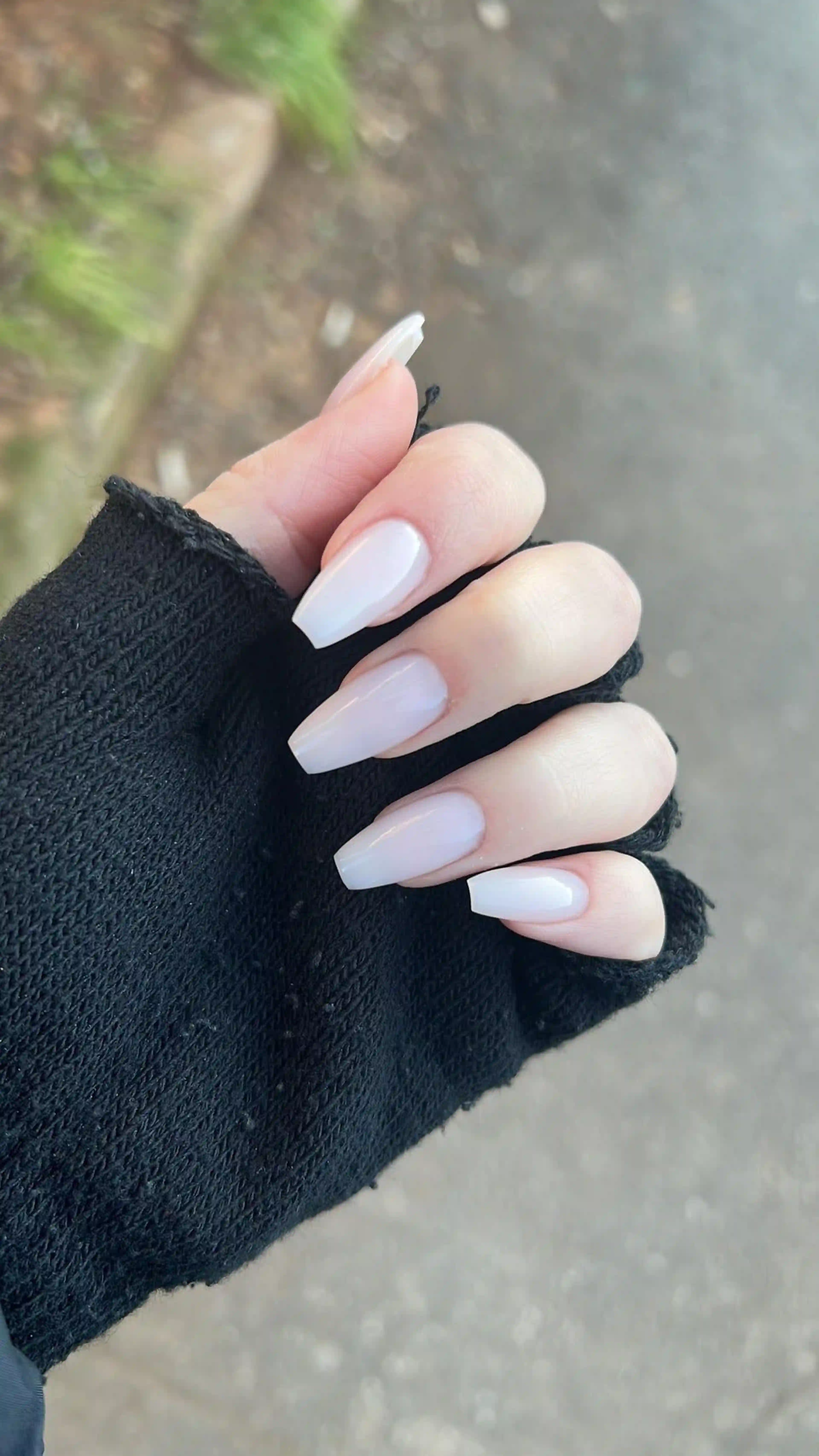 Milky white coffin clean minimal nails creating modern elegant professional manicure for office wear