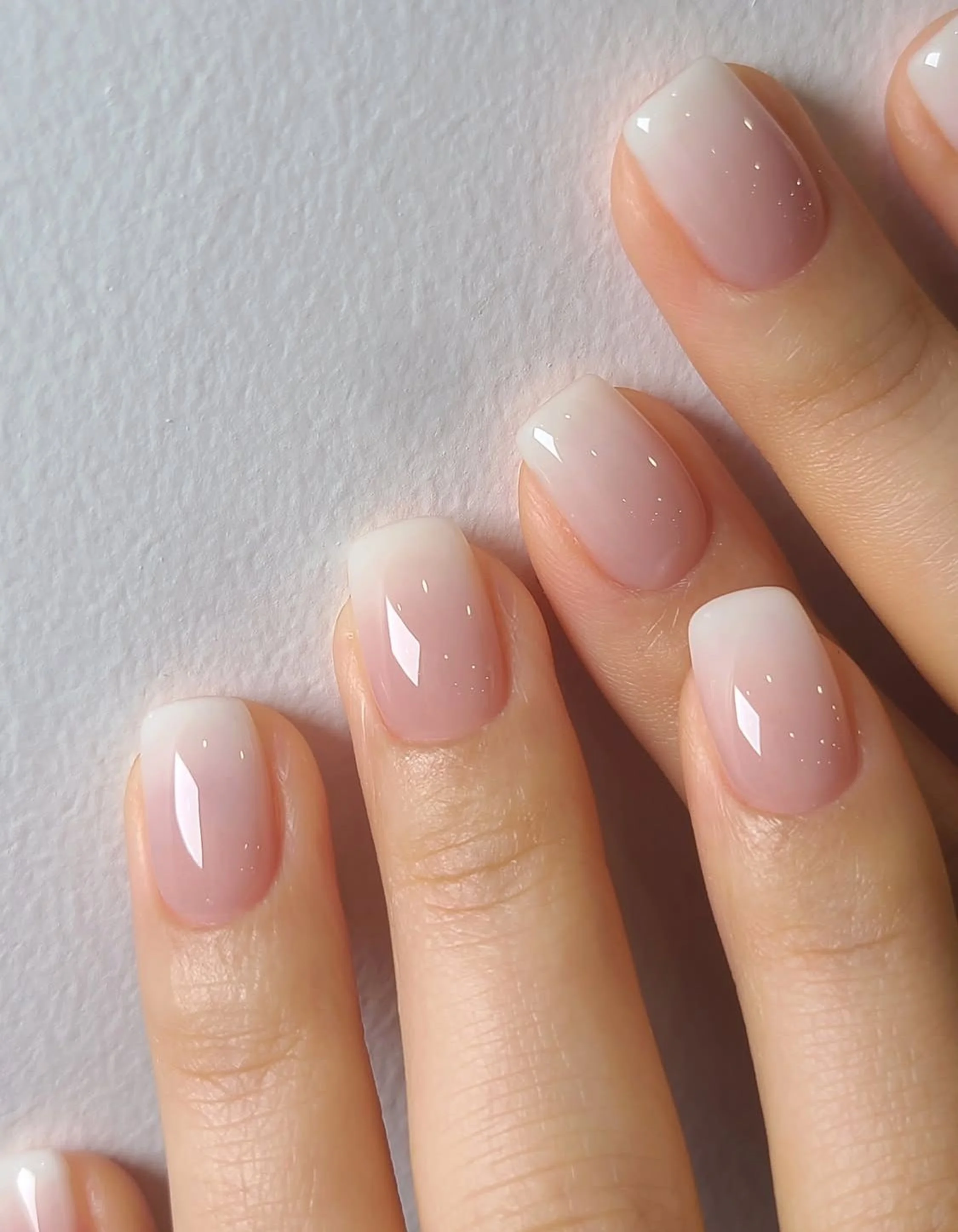 Milky white glossy short nails creating clean simple trending minimalist winter manicure perfect for fresh modern elegant aesthetic